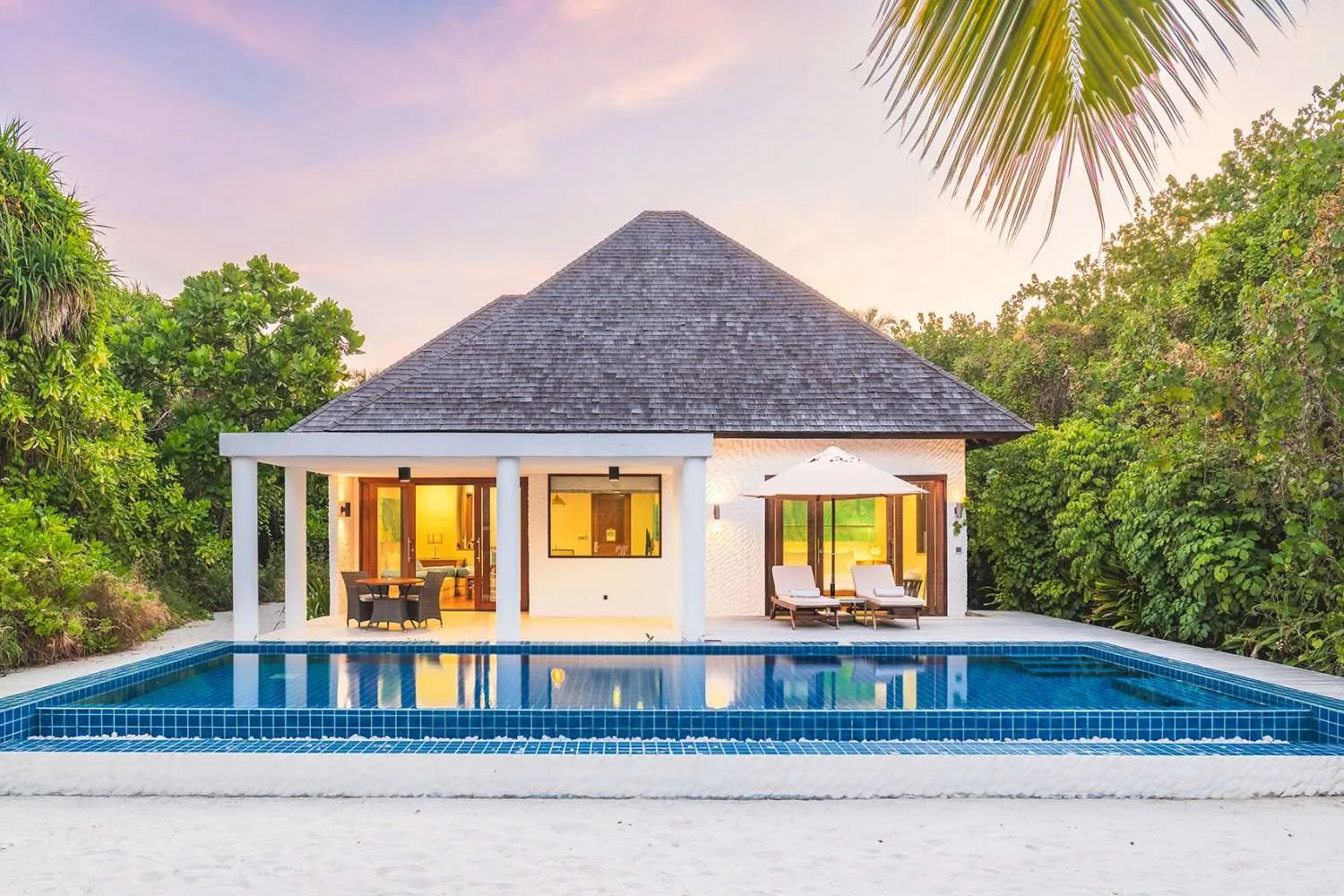 - 315 Sqm - Nestled in a lush tropical garden - This beach front haven offers ultimate privacy - Bedroom opening to a private terrace with a pool - Just moments away from the beach - Separate living and dining area - Spacious bathroom with a rejuvenating jacuzzi bathtub - Designed for pure relaxation