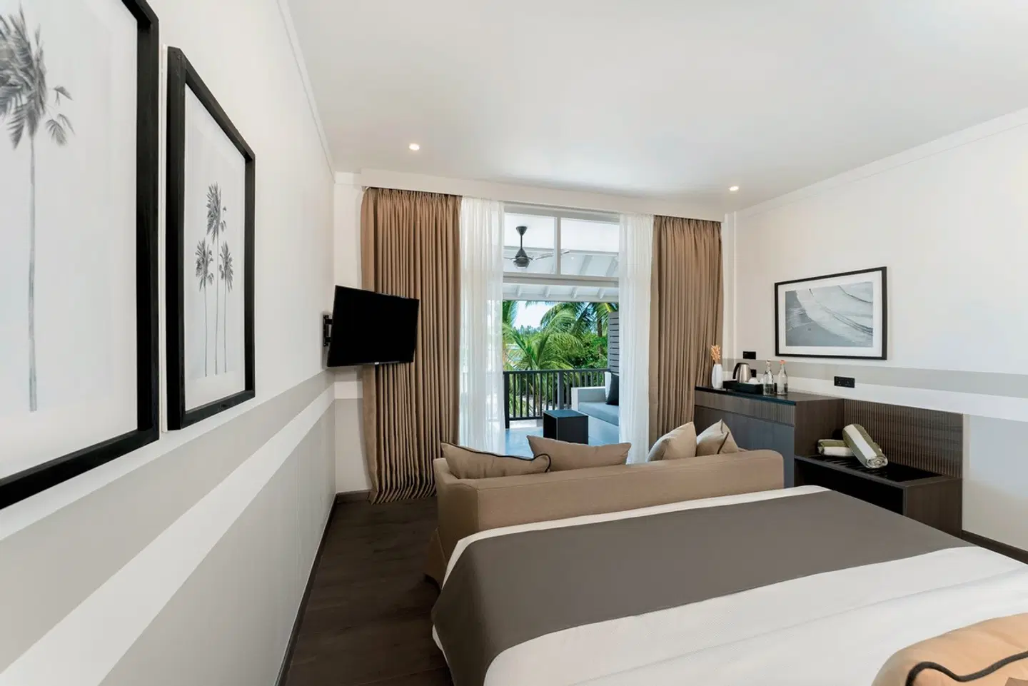 - The taupe, black, and grey palette lends tranquility to the interiors The room, although on the cozier size, is cleverly designed and thoughtfully set as a non smoking space Terrace or balcony, daybed, couch… It’s all there. Yet you don’t feel cramped. The gorgeous black and white photography on the walls adds to the serene vibe The pavilions' rooms can be interconnected with rooms with Twin or King size beds The Maldives' longest swimming pool at 210 meters with its sunken bar is located right outside the Beach Pavilion room category
