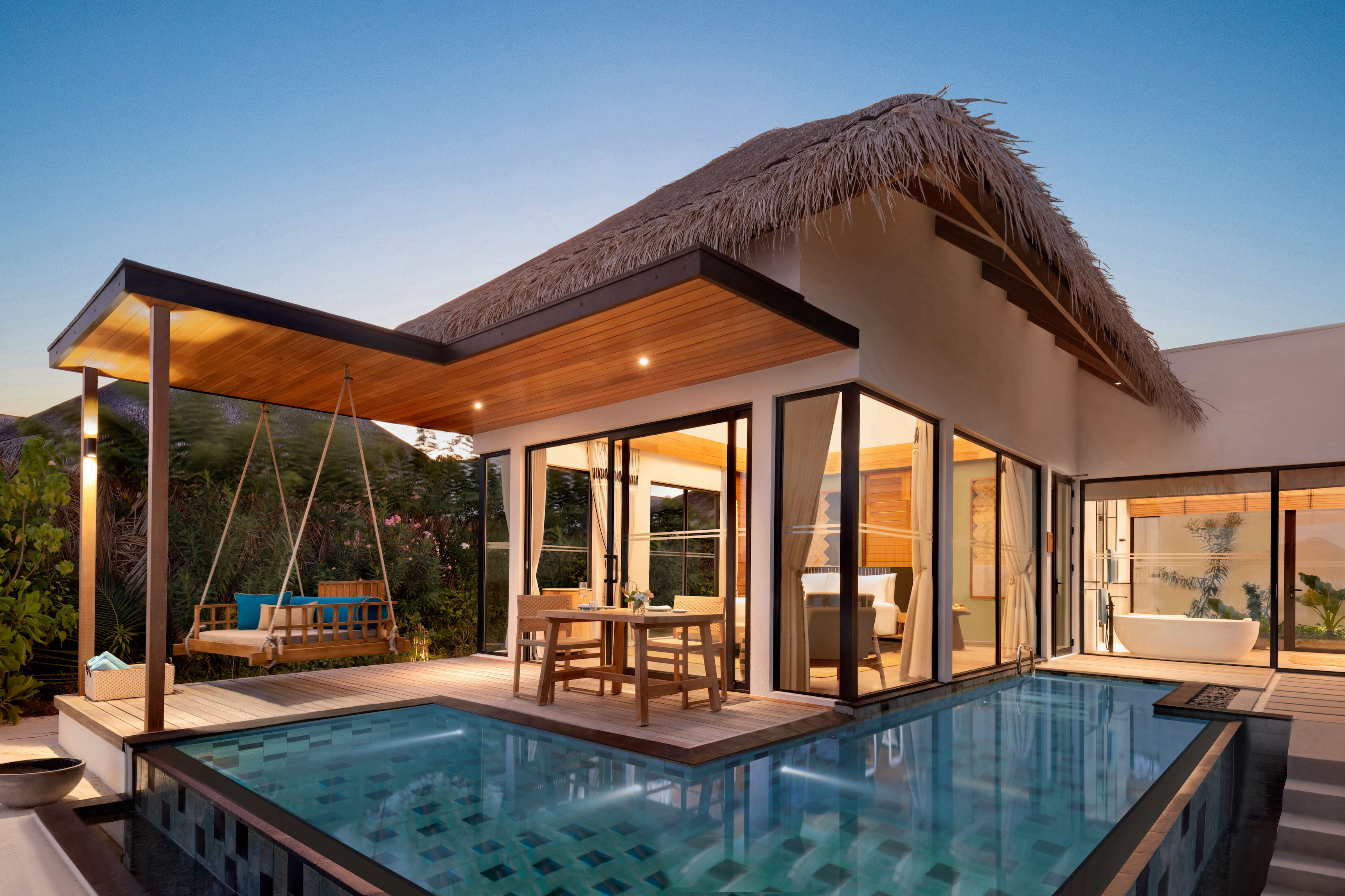 - 138 sq. m. / 1485 sq. ft., private pool, direct beach access - This beautiful villa is nestled within lush landscaping, with sandy ocean shores only steps away. The outdoor space features a pool and sundeck with dining area, sun loungers, a swing and a gazebo.
- The villa includes a king size bed, complimentary WiFi, coffee / tea facilities, a 55 inch HDTV, laptop safe, air conditioning, mini bar, and ceiling fan. Additional amenities include an ensuite bathroom, outdoor shower, bathrobes, and slippers. Sleeps 3 with a rollaway bed.