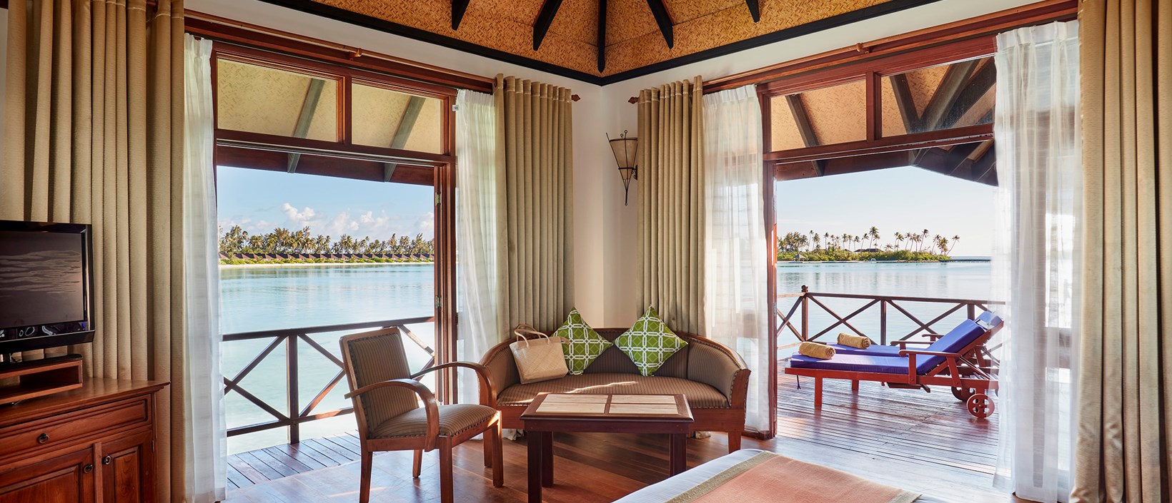 - With its shingled roof and dark wood furnishings, this villa exudes a traditional charm The wooden sundeck is the perfect spot to soak up the sun and take in the views of the various islands that make up the Olhuveli compound Our standard overwater level is the perfect hideaway for two