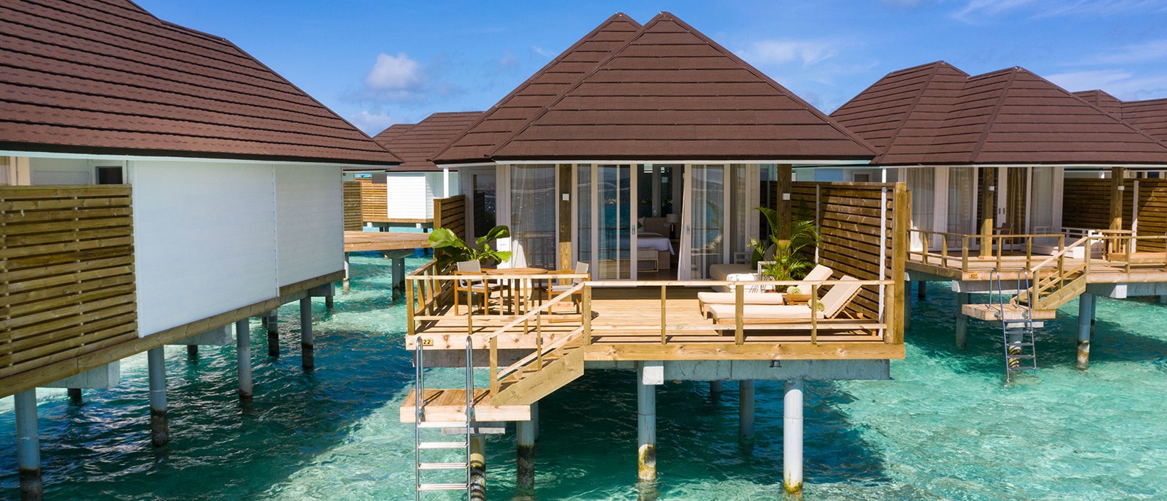 - Pale wood furnishings, indoor plants, and warm pastel tones give this villa its contemporary aesthetic. Spacious, each villa has a wooden deck with all the creature comforts needed to relax: sunbeds, a table and chairs, and a daybed A stairway leads down to the turquoise warm waters. Our Grand Water Villa is designed for a modern family of four